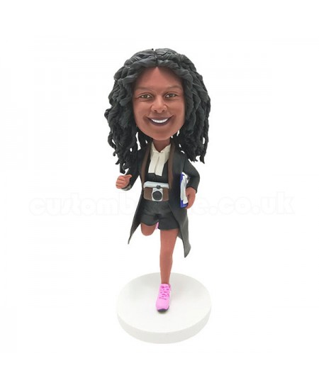 custom running reporter with a camera bobblehead