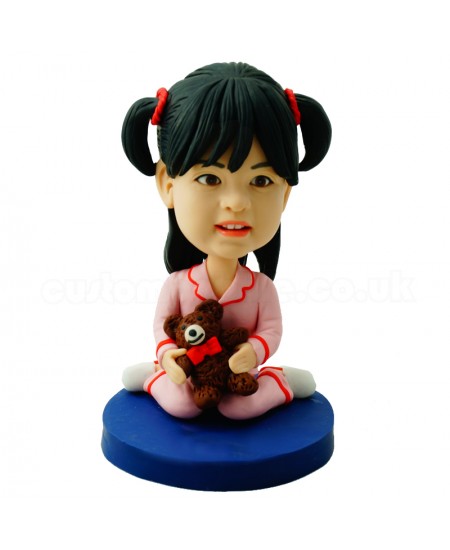 customised deary girl in pajamas carrying a bear doll
