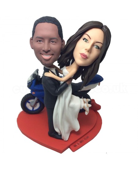 customised wedding bobblehead beside a motorbike
