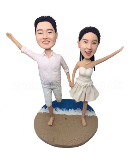running on sandbeach hand in hand couple