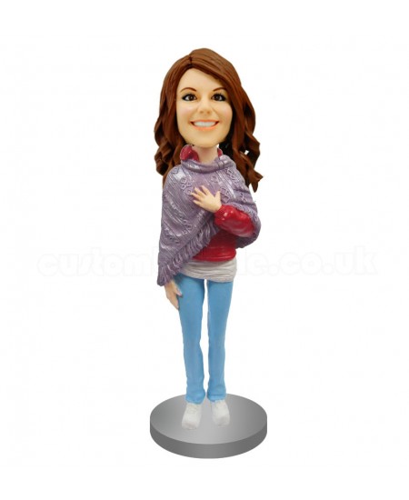 customized bobblehead in poncho and jeans