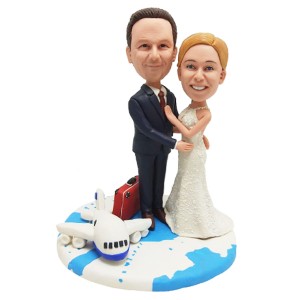 custom bobblehead travel around the world wedding cake topper