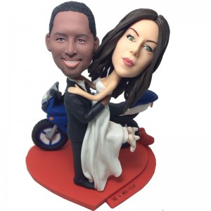 customised wedding bobblehead beside a motorbike