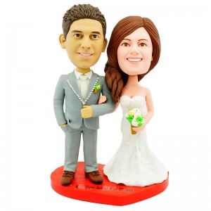 customised wedding cake topper bride holding grooms arm