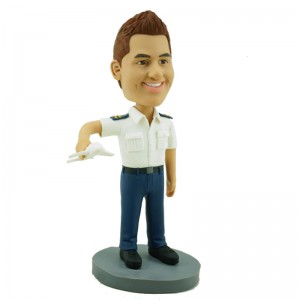 personalised pilot bobblehead carrying a model plane