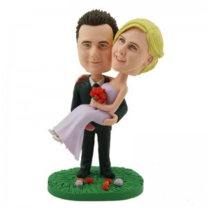 personalised wedding cake topper groom holding up bride