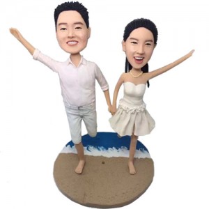 running on sandbeach hand in hand couple