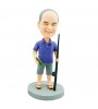 custom fishing man bobblehead carrying a rod