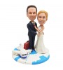 custom bobblehead travel around the world wedding cake topper