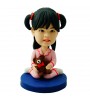 customised deary girl in pajamas carrying a bear doll