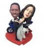 customised wedding bobblehead beside a motorbike
