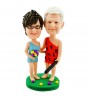 personalised couple bobblehead in fancy dress with a wooden stick