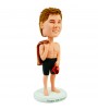personalised strong swimmer bobblehead with school uniform on the back